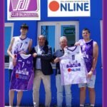 Group of five men in purple basketball jerseys posing in front of a blue building, holding matching team banners with the ONLINE logo.